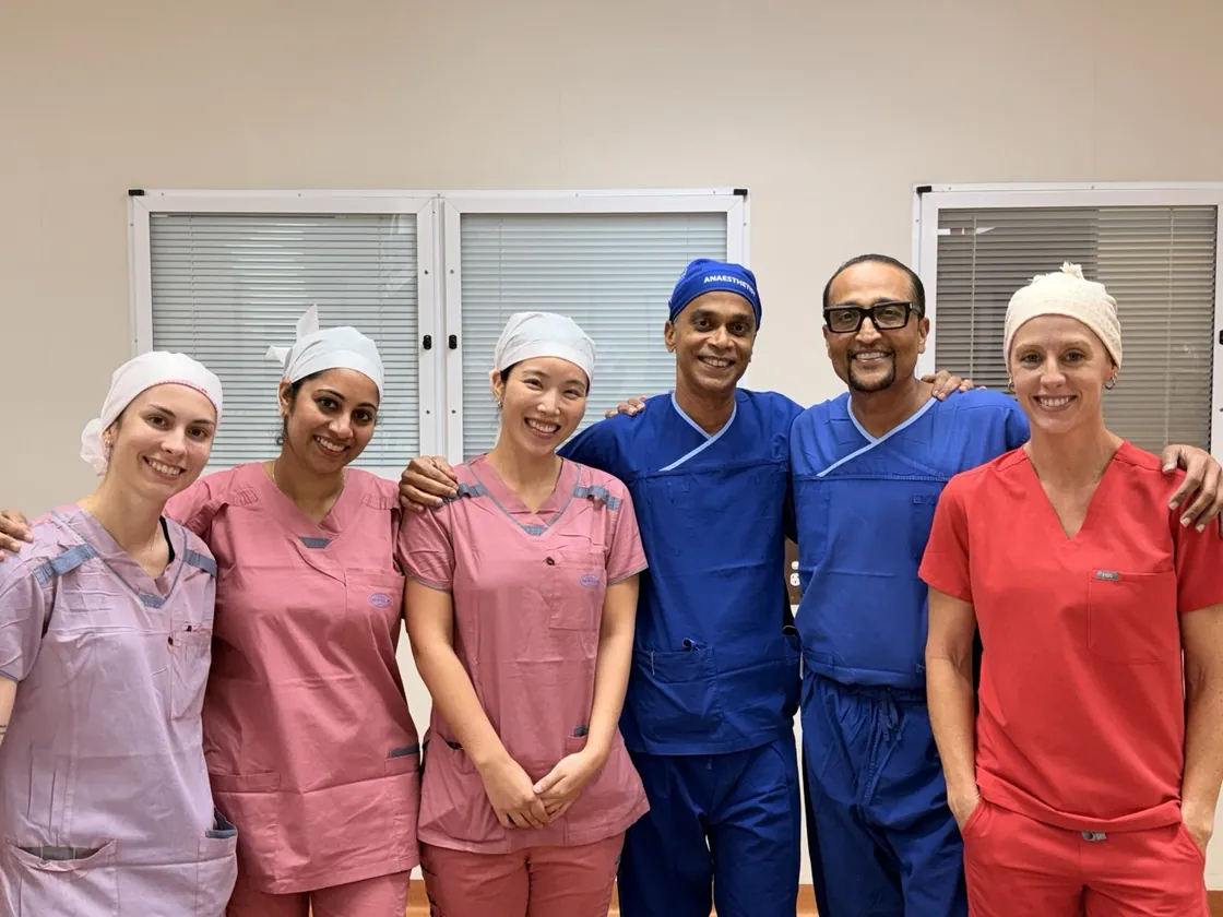 Dr. Kosh with his orthopaedic surgical team in theatre scrubs before a knee procedure